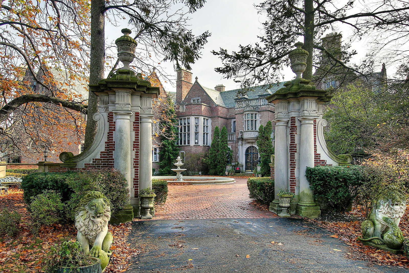 Vintage gate facing towards a mansion